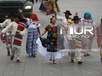 People participate in the military civic parade for the commemoration of the 114th anniversary of the Mexican Revolution at the main square...