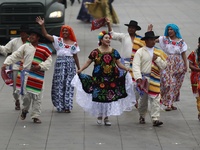 People participate in the military civic parade for the commemoration of the 114th anniversary of the Mexican Revolution at the main square...