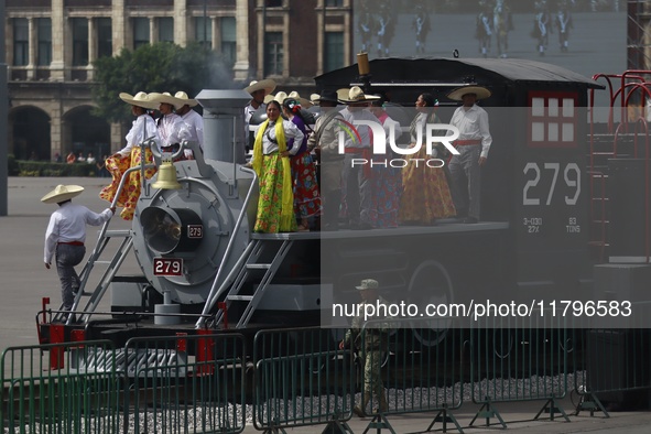 People participate in the military civic parade for the commemoration of the 114th anniversary of the Mexican Revolution at the main square...