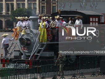 People participate in the military civic parade for the commemoration of the 114th anniversary of the Mexican Revolution at the main square...