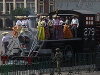 People participate in the military civic parade for the commemoration of the 114th anniversary of the Mexican Revolution at the main square...