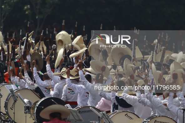 People participate in the military civic parade for the commemoration of the 114th anniversary of the Mexican Revolution at the main square...