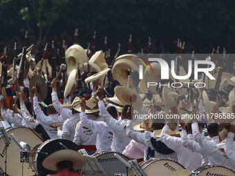 People participate in the military civic parade for the commemoration of the 114th anniversary of the Mexican Revolution at the main square...