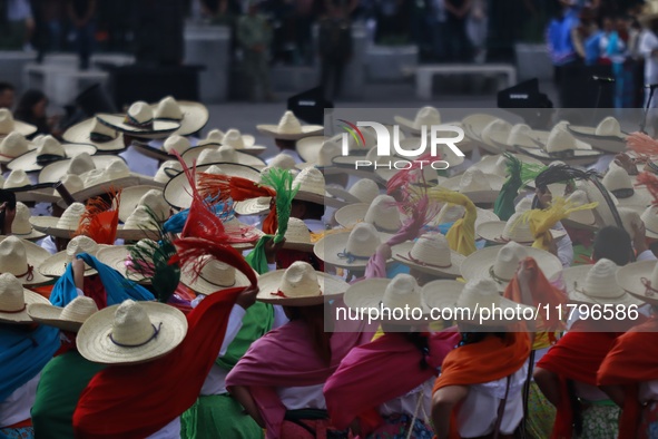 People participate in the military civic parade for the commemoration of the 114th anniversary of the Mexican Revolution at the main square...