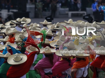 People participate in the military civic parade for the commemoration of the 114th anniversary of the Mexican Revolution at the main square...