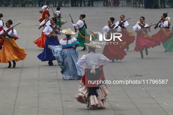 People participate in the military civic parade for the commemoration of the 114th anniversary of the Mexican Revolution at the main square...