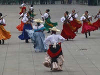 People participate in the military civic parade for the commemoration of the 114th anniversary of the Mexican Revolution at the main square...