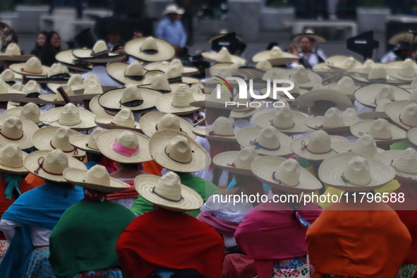 People participate in the military civic parade for the commemoration of the 114th anniversary of the Mexican Revolution at the main square...