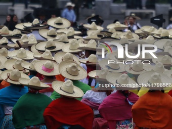 People participate in the military civic parade for the commemoration of the 114th anniversary of the Mexican Revolution at the main square...