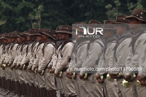 People participate in the military civic parade for the commemoration of the 114th anniversary of the Mexican Revolution at the main square...