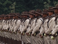 People participate in the military civic parade for the commemoration of the 114th anniversary of the Mexican Revolution at the main square...