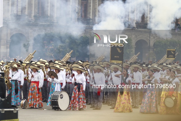 People participate in the military civic parade for the commemoration of the 114th anniversary of the Mexican Revolution at the main square...