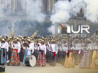 People participate in the military civic parade for the commemoration of the 114th anniversary of the Mexican Revolution at the main square...