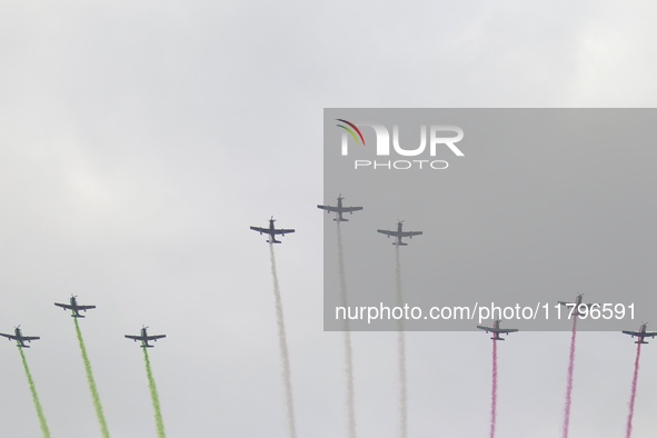 Pilots fly in the sky during the military civic parade for the commemoration of the 114th anniversary of the Mexican Revolution at the main...