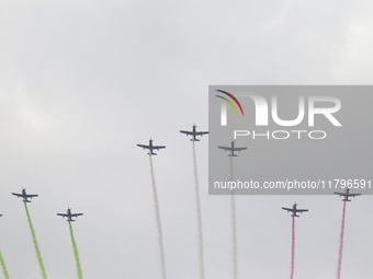 Pilots fly in the sky during the military civic parade for the commemoration of the 114th anniversary of the Mexican Revolution at the main...