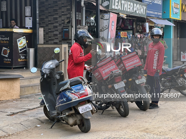 Zomato food delivery drivers pick up orders from a restaurant in Thiruvananthapuram (Trivandrum), Kerala, India, on April 9, 2024. 