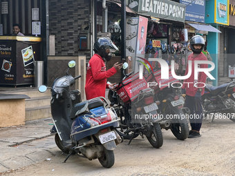 Zomato food delivery drivers pick up orders from a restaurant in Thiruvananthapuram (Trivandrum), Kerala, India, on April 9, 2024. (