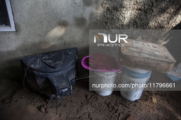 Residents clean their homes and try to save the remaining belongings after a flash flood hits Mekarbuana village, Karawang district, West Ja...