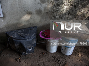 Residents clean their homes and try to save the remaining belongings after a flash flood hits Mekarbuana village, Karawang district, West Ja...