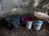 Residents clean their homes and try to save the remaining belongings after a flash flood hits Mekarbuana village, Karawang district, West Ja...