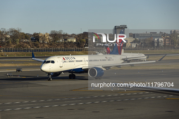 Delta Air Lines Airbus A220-300 passenger aircraft spotted taxiing on the runway and taxiway of LaGuardia airport in NYC. The narrow body Ai...