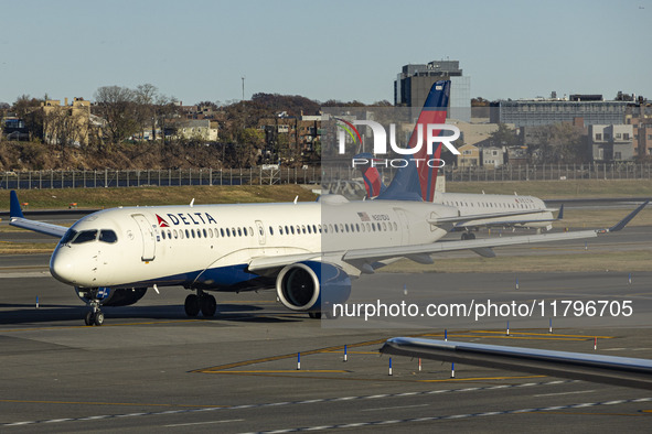 Delta Air Lines Airbus A220-300 passenger aircraft spotted taxiing on the runway and taxiway of LaGuardia airport in NYC. The narrow body Ai...