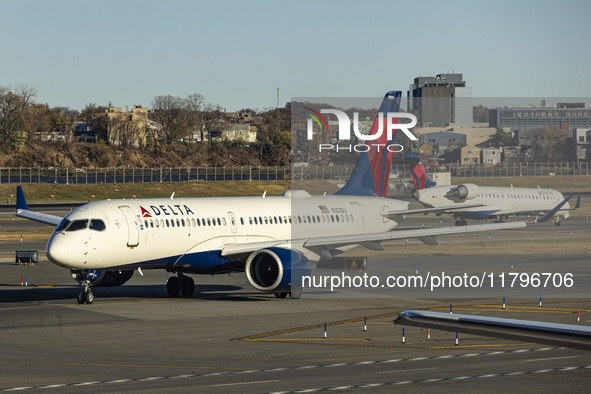 Delta Air Lines Airbus A220-300 passenger aircraft spotted taxiing on the runway and taxiway of LaGuardia airport in NYC. The narrow body Ai...