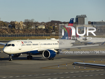 Delta Air Lines Airbus A220-300 passenger aircraft spotted taxiing on the runway and taxiway of LaGuardia airport in NYC. The narrow body Ai...