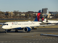 Delta Air Lines Airbus A220-300 passenger aircraft spotted taxiing on the runway and taxiway of LaGuardia airport in NYC. The narrow body Ai...