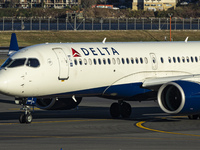 Delta Air Lines Airbus A220-300 passenger aircraft spotted taxiing on the runway and taxiway of LaGuardia airport in NYC. The narrow body Ai...