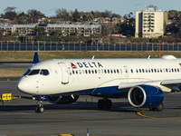 Delta Air Lines Airbus A220-300 passenger aircraft spotted taxiing on the runway and taxiway of LaGuardia airport in NYC. The narrow body Ai...