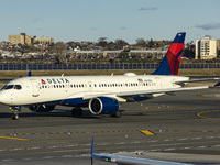 Delta Air Lines Airbus A220-300 passenger aircraft spotted taxiing on the runway and taxiway of LaGuardia airport in NYC. The narrow body Ai...