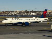 Delta Air Lines Airbus A220-300 passenger aircraft spotted taxiing on the runway and taxiway of LaGuardia airport in NYC. The narrow body Ai...