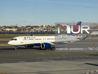 Delta Air Lines Airbus A220-300 passenger aircraft spotted taxiing on the runway and taxiway of LaGuardia airport in NYC. The narrow body Ai...