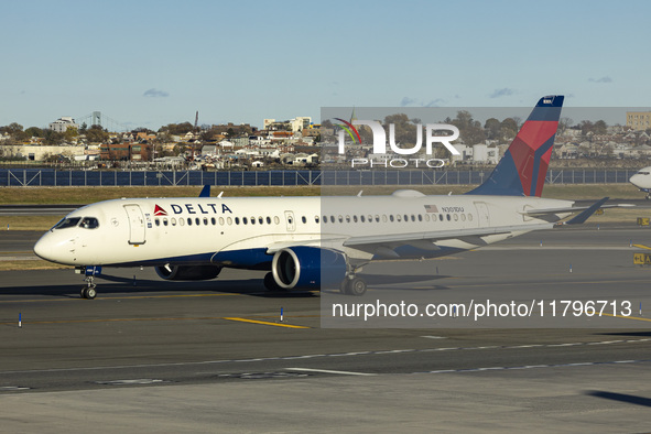 Delta Air Lines Airbus A220-300 passenger aircraft spotted taxiing on the runway and taxiway of LaGuardia airport in NYC. The narrow body Ai...