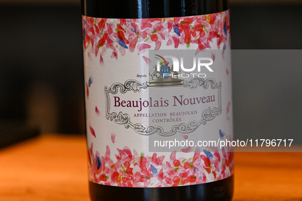 KRAKOW, POLAND - NOVEMBER 20:   
A wine label of a freshly arrived bottle of Beaujolais Nouveau displayed inside a wine bar in Krakow's Old...