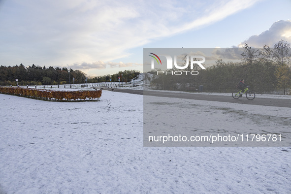 People spotted on their bicycle during with the snow around them. First winter weather of the season with snow hit the Netherlands. Low temp...