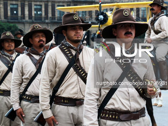 Members of the Mexican armed forces, dressed in attire from the era of the Mexican Revolution, pose before the parade for the 114th annivers...