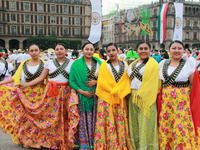 Women dressed as Adelitas, who participate in the Mexican Revolution, are seen before the parade on the occasion of the 114th anniversary of...