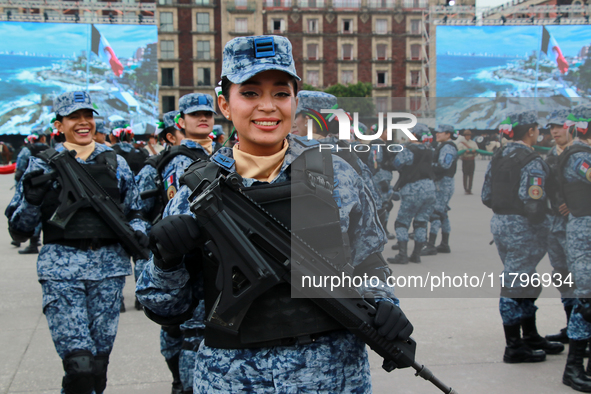 A woman from the Mexican armed forces poses before the parade for the 114th anniversary of the Mexican Revolution at the Zocalo capital in M...