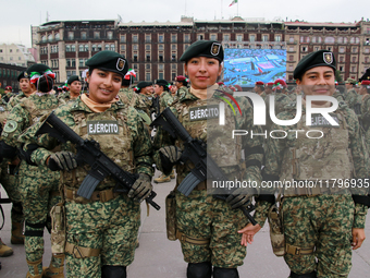 Women belonging to the Mexican Army pose before the parade on the occasion of the 114th anniversary of the Mexican Revolution at the Zocalo...