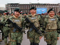 Women belonging to the Mexican Army pose before the parade on the occasion of the 114th anniversary of the Mexican Revolution at the Zocalo...