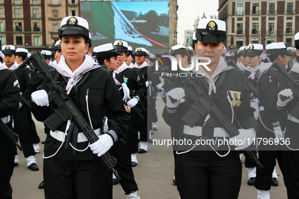 Women belonging to the Mexican Navy pose before the parade for the 114th anniversary of the Mexican Revolution at the Zocalo capital in Mexi...