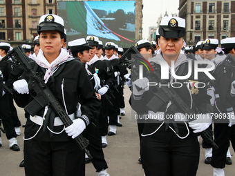 Women belonging to the Mexican Navy pose before the parade for the 114th anniversary of the Mexican Revolution at the Zocalo capital in Mexi...