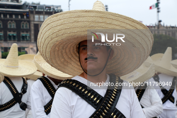 An element of the Mexican armed forces, dressed in attire from the time of the Mexican Revolution, stands before the parade on the occasion...