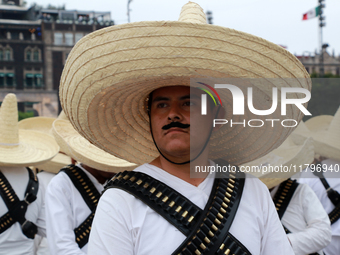 An element of the Mexican armed forces, dressed in attire from the time of the Mexican Revolution, stands before the parade on the occasion...