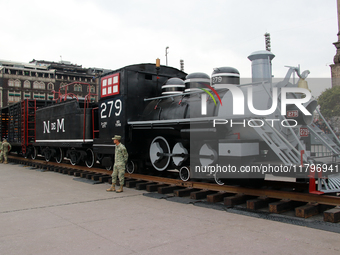 A replica of a locomotive from the time of the Mexican Revolution is seen before the parade on the occasion of the 114th anniversary of the...