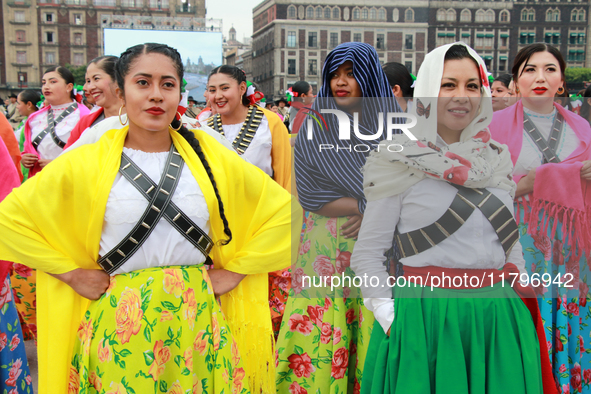 Women dressed as Adelitas, who participate in the Mexican Revolution, are seen before the parade on the occasion of the 114th anniversary of...