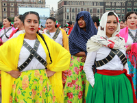 Women dressed as Adelitas, who participate in the Mexican Revolution, are seen before the parade on the occasion of the 114th anniversary of...