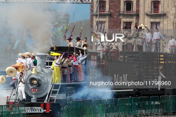 Members of the armed forces, dressed in attire from the time of the Mexican Revolution, stage a scene from the Mexican Revolution on a repli...